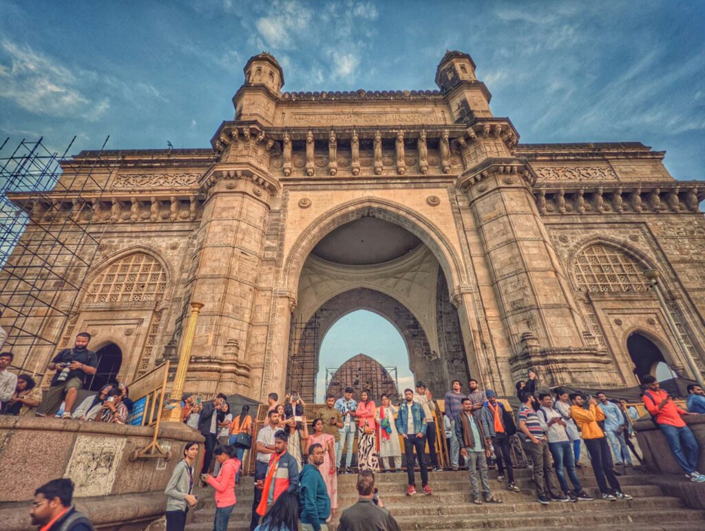 A massive crowd gathered in front of the Gateway of India at 6 am, disrupting the usual morning serenity with bustling activity overshadowing its tranquil charm.