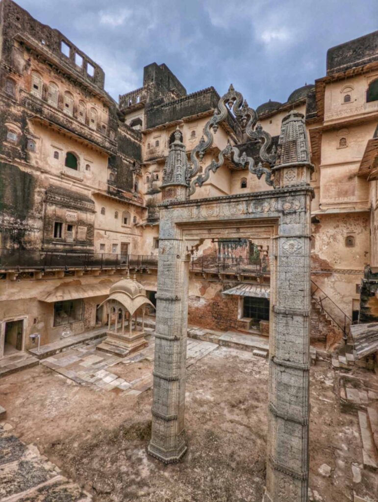 A picturesque view of Jhoola Chowk in Bundi, Rajasthan, featuring a traditional swing, ornate arches, and intricate architectural details, evoking the elegance of the royal era.