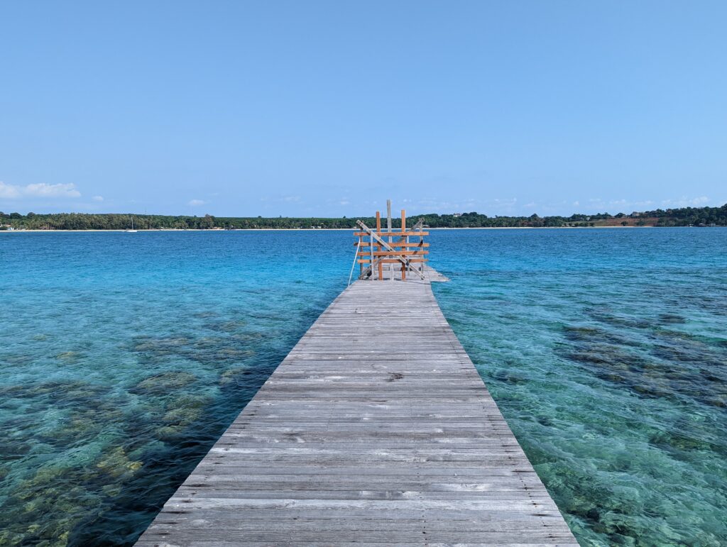 A breathtaking view of the serene Koh Kham Island in Trat, Thailand, featuring crystal-clear turquoise waters offering a slice of untouched paradise.