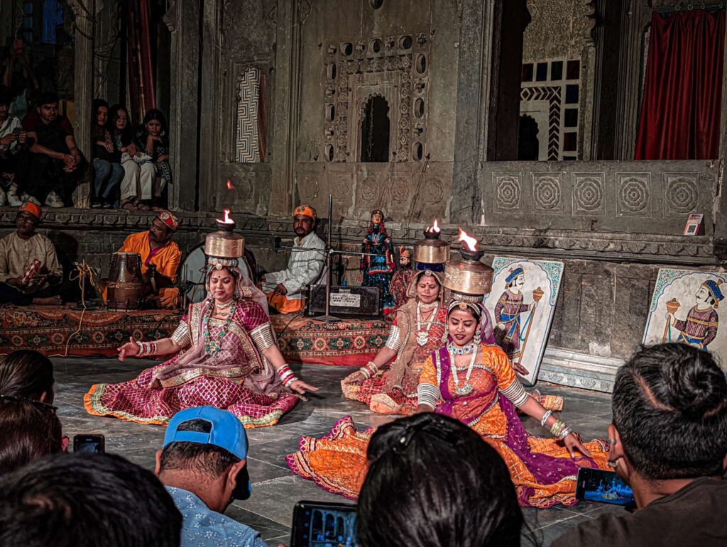 Rajasthani folk dance depicting women dancing with pots on their head. Pots are filled with fire.