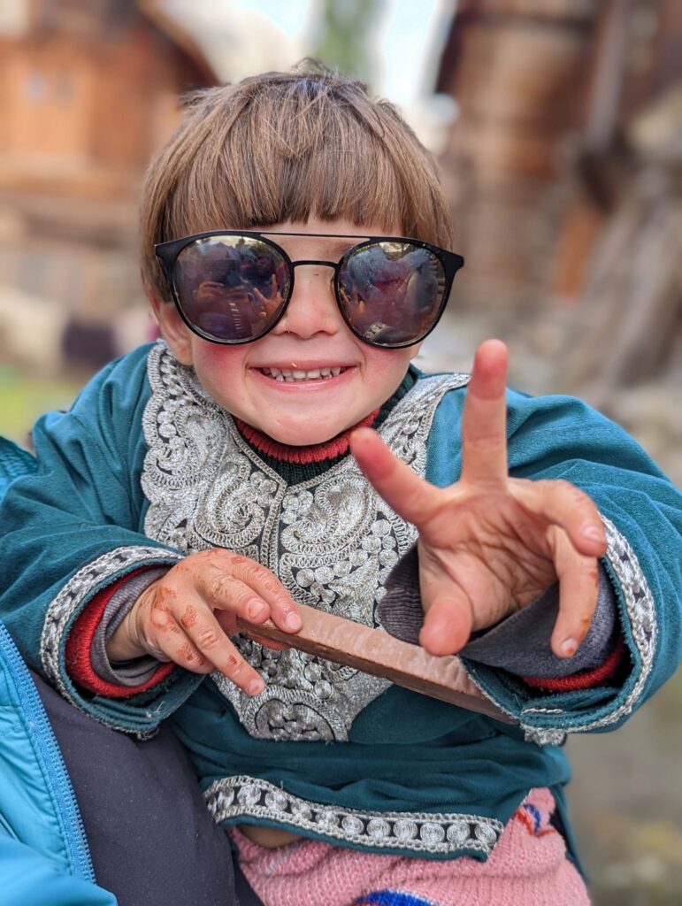 Child from Himalayas depicting utmost innocence & wanting to eat chocolate