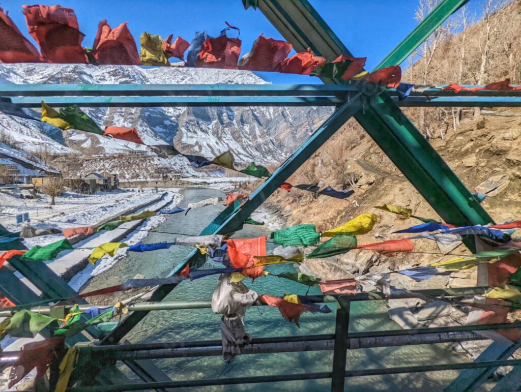 Scenic view of the Chandrabhaga River from the iconic Tandi Bridge in Lahaul Valley where there is the confluence of River Chandra and River Bhaga amidst breathtaking Himalayan landscapes.