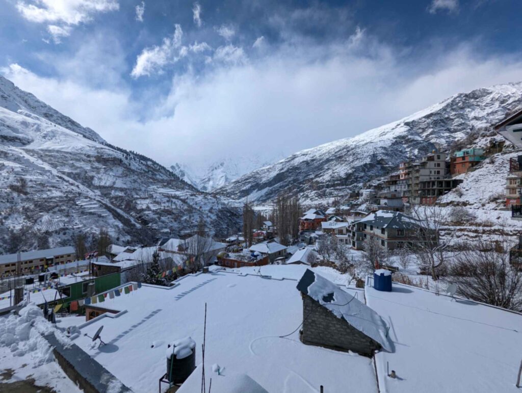 "Snow-covered landscape in Keylong, Lahaul Valley, Himachal Pradesh, featuring majestic mountains, white-capped peaks, and a serene winter atmosphere."