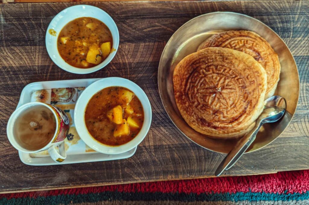 Beautiful traditional design imprinted Puri with Potato sabji at Khandroling Homestay.