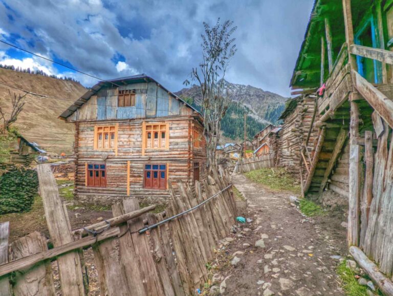 Beautiful village in Tulail valley, Kashmir featuring ancient wooden houses.