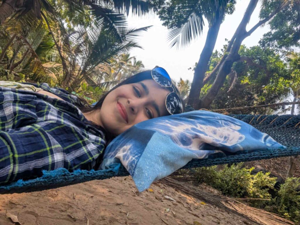 Chilling in the hammock under coconut trees at Aapa's Coconut garden homestay, Talashil, Malvan