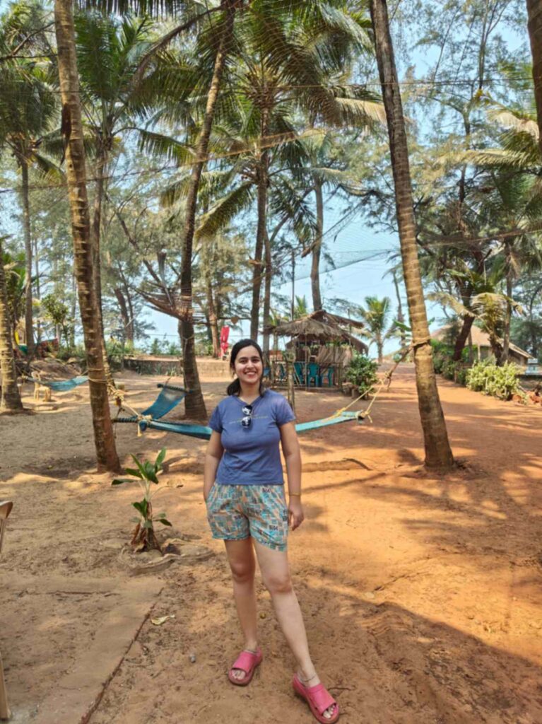 Enjoying in Aapa’s Coconut Garden Homestay in Talashil Tondavli, Malvan — surrounded by lush coconut trees with a serene view of the Arabian Sea